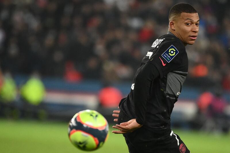 Kylian Mbappe eyes the ball. AFP