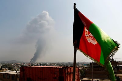 TOPSHOT - Smoke rises from the site of an attack after a massive explosion the night before near the Green Village in Kabul on September 3, 2019. A massive blast in a residential area of Kabul killed at least 16 people, officials said on September 3, yet another Taliban attack that came as the insurgents and Washington try to finalise a peace deal. / AFP / Wakil KOHSAR
