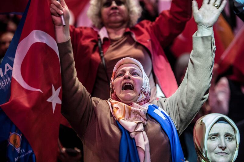 A supporter of the Turkish President cheers as she waits for the start of his speech in Istanbul, on May 6, 2018.
Turkey will hold parliamentary and presidential elections on June 24, 2018, seen as important as it will transform Turkey's governing system to an executive presidency. The main opposition Republican People’s Party (CHP), the IYI (Good) Party, the conservative Saadet Party (SP) and the Democrat Party (DP) formed the Alliance for the Nation to stand against the People's Alliance of Erdogan's ruling Justice and Development Party (AKP) and the Nationalist Movement Party (MHP). / AFP PHOTO / BULENT KILIC