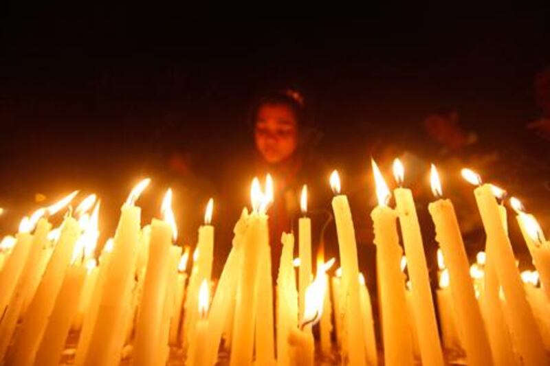 A girl lights candles during a candlelight vigil for a gang rape victim who was assaulted in New Delhi. Reuters / Rupak De Chowdhuri