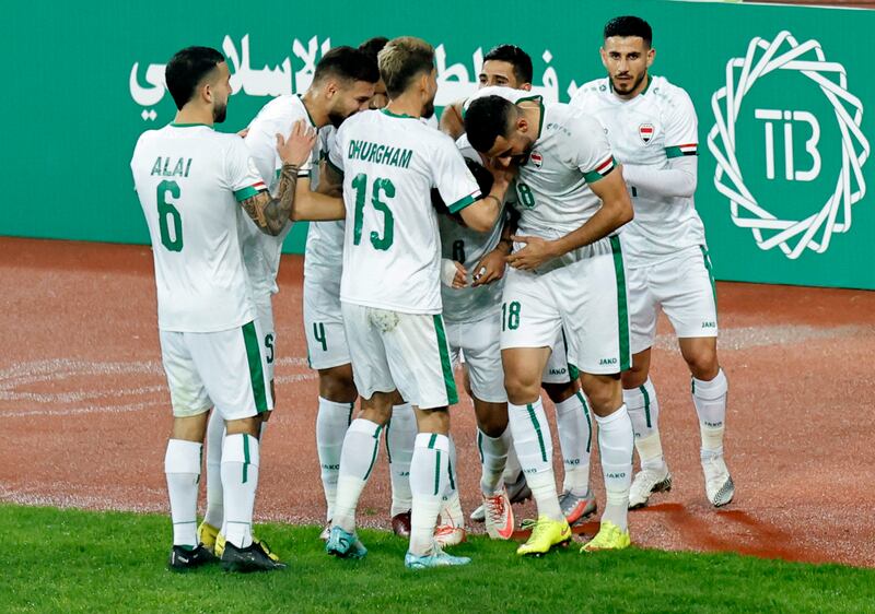 Bayesh celebrates with teammates after scoring Iraq's first goal. Reuters