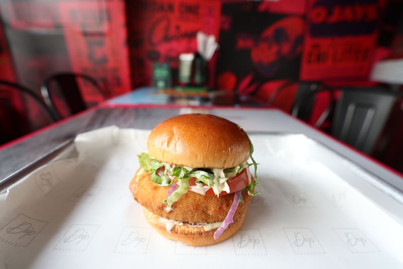 Drip's vegan burger has a homemade crumbed sweet potato mash and chickpea patty with the restaurant's own ketchup, tahini sauce, lettuce and tomato, all piled on a vegan bun