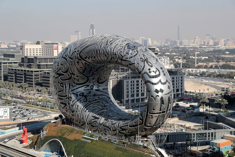 DUBAI, UNITED ARAB EMIRATES , Feb 3 – Workers working on The Museum of the Future on Sheikh Zayed road in Dubai. (Pawan Singh / The National) For News/Online/Standalone/Instagram/Big Picture