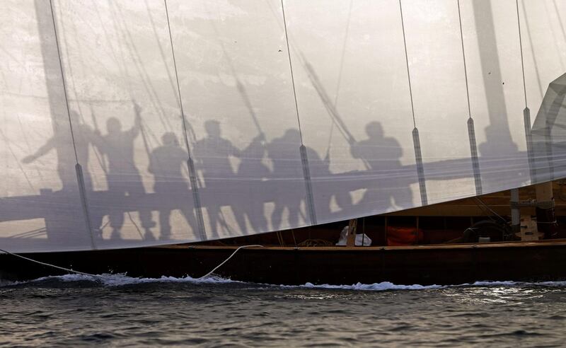 Sailors participate in a training session on the eve of al-Gaffal traditional long-distance dhow sailing race near the island of Sir Bu Nair on May 13, 2017. Over a hundred traditional dhow racing boats will take part in al-Gaffal race from Sir Bu Nayer Island to Dubai. / AFP / Karim SAHIB
