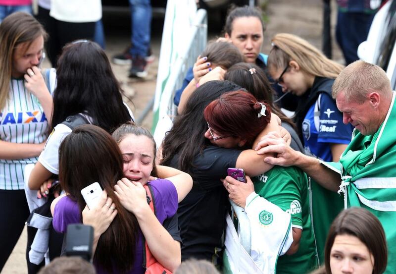 Fans of Chapecoense football team react in front of the Arena Conda stadium in Chapeco, Brazil. Paulo Whitaker / Reuters