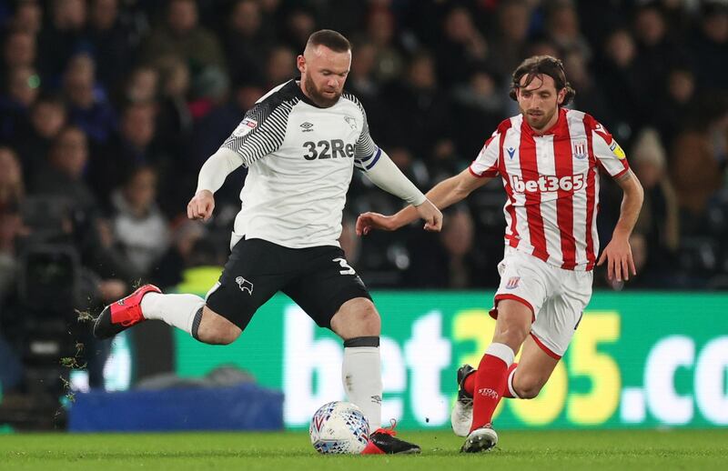 Derby County's Wayne Rooney, left, in action during their 4-0 win against Stoke City in the Championship on Friday. Reuters
