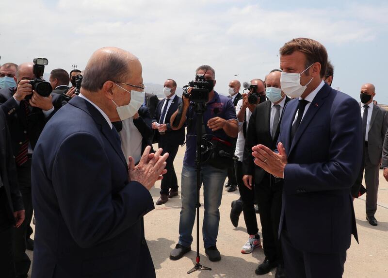 Lebanon's President Michel Aoun welcomes French President Emmanuel Macron on his arrival at the airport in Beirut. Dalati Nohra/Reuters