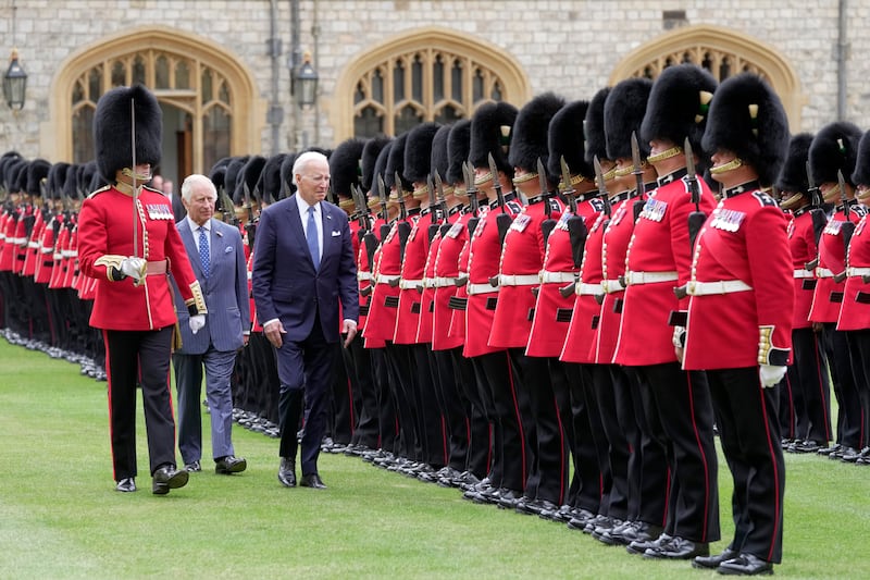 King Charles and US President Joe Biden review a guard of honour at Windsor Castle in July 2023