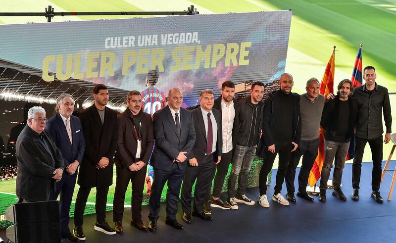 Sergio Aguero poses for a group picture with Barcelona players and management. AFP