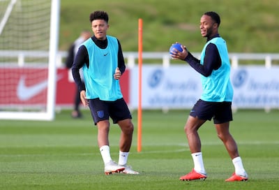 BURTON-UPON-TRENT, ENGLAND - OCTOBER 11: Jadon Sancho of England and Raheem Sterling of England train during the England Training Session at St Georges Park on October 11, 2018 in Burton-upon-Trent, England.  (Photo by Catherine Ivill/Getty Images)
