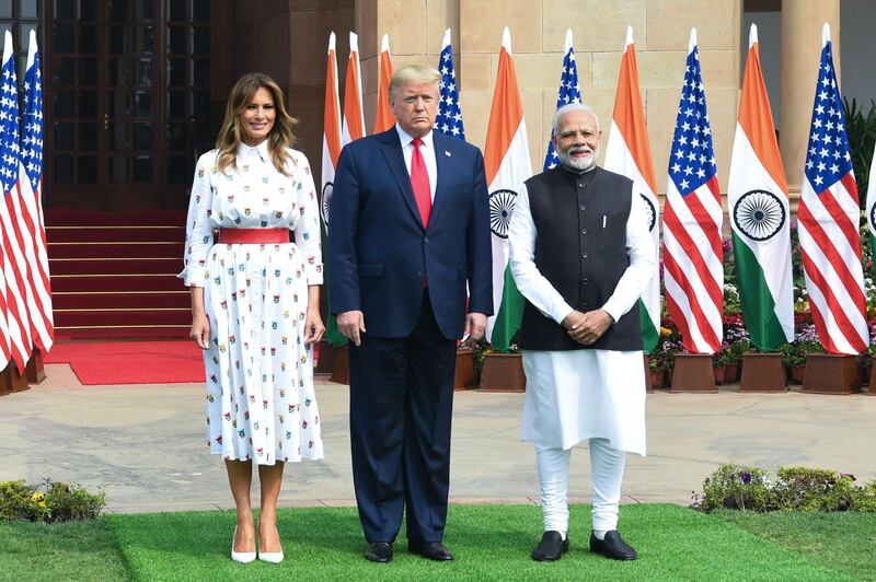 India's Prime Minister Narendra Modi, US President Donald Trump and First Lady Melania Trump pose before a meeting at Hyderabad House in New Delhi.  AFP