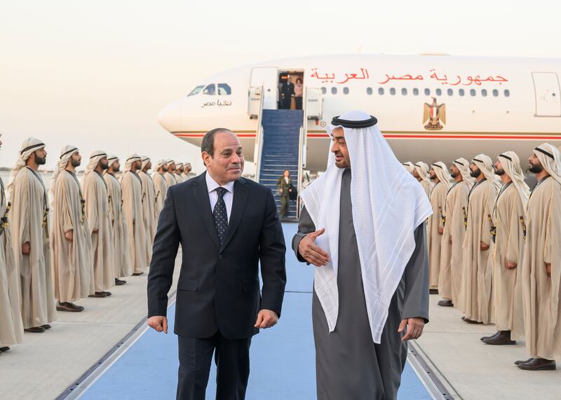 President Sheikh Mohamed receives Egypt's President Abdel Fattah El Sisi at Abu Dhabi's Presidential Airport. Hamad Al Kaabi /  UAE Presidential Court 