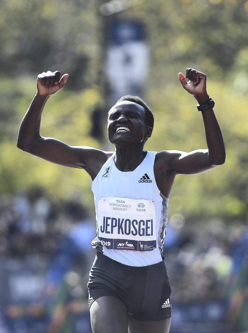 NEW YORK, NEW YORK - NOVEMBER 03: Joyciline Jepkosgei of Kenya reacts as she crosses the finish line to win the Women's Division of the 2019 TCS New York City Marathon on November 03, 2019 in New York City.   Sarah Stier/Getty Images/AFP