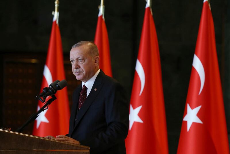 Turkey's President Recep Tayyip Erdogan addresses his country's ambassadors in Ankara, Turkey, Tuesday, Aug. 6, 2019. Turkey's combative president is threatening to launch a military operation in northeastern Syria that is designed to push back U.S.-allied Syrian Kurdish forces, an invasion that carries major risks for a highly combustible region in war-devastated Syria.(Presidential Press Service via AP, Pool)