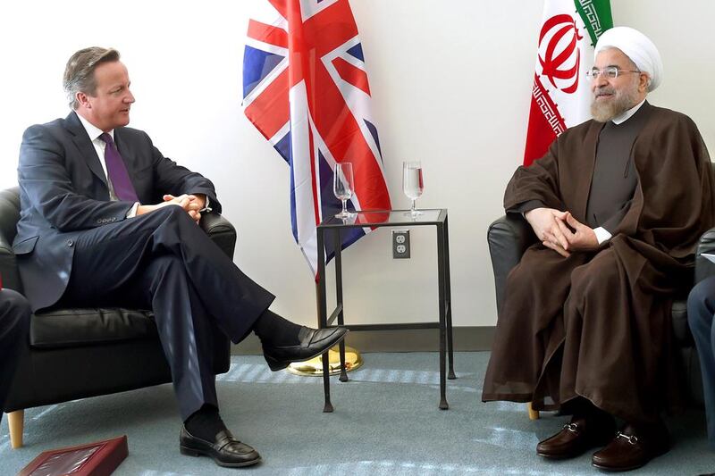 British prime minister David Cameron meets with Iranian president Hassan Rouhani at the UN during the 69th Session of the UN General Assembly on September 24, 2014 in New York.  Timothy Clary / AFP