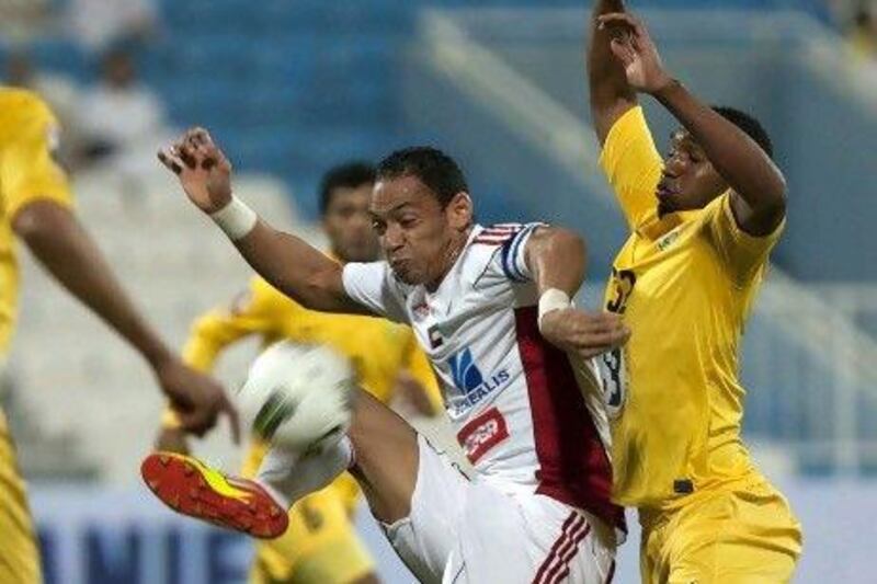 Al Wasl, in yellow, defeated Al Jazira 4-3 last night.