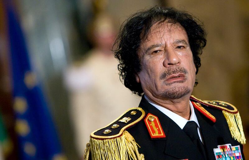 Libya's leader Muammar Gaddafi looks on during a news conference at the Quirinale palace in Rome in this June 10, 2009 file photo. Deposed Libyan leader Gaddafi has been captured and wounded in both legs, National Transitional Council official Abdel Majid said on October 20, 2011. "He's captured. He's wounded in both legs ... He's been taken away by ambulance," the senior NTC military official told Reuters by telephone.   REUTERS/Max Rossi/Files (ITALY - Tags: POLITICS HEADSHOT CIVIL UNREST) *** Local Caption ***  SIN24_LIBYA-_1020_11.JPG