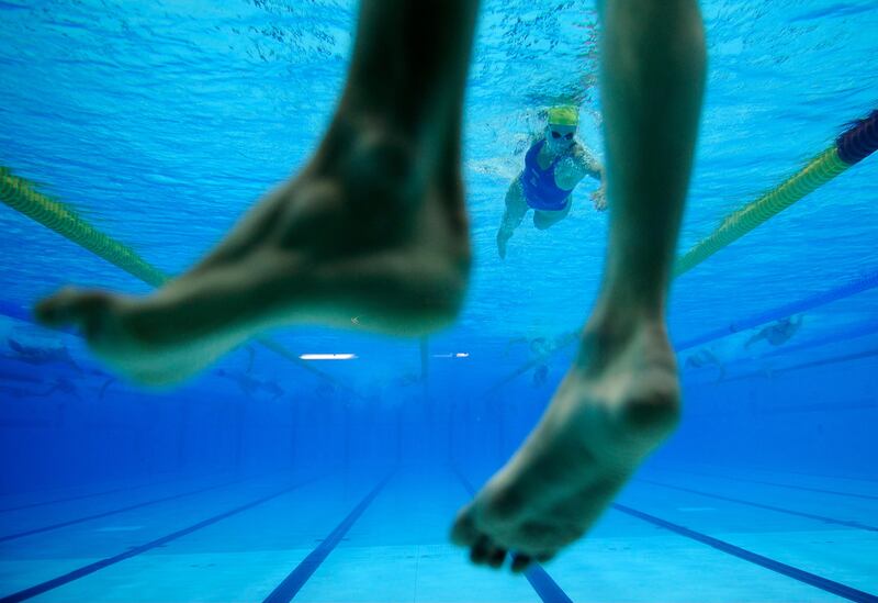 Swimmers practice at the Aquatics Center at the Olympic Park ahead of the 2012 Summer Olympics, Wednesday, July 25, 2012, in London. Opening ceremonies for the 2012 London Olympics will be held Friday, July 27.(AP Photo/Daniel Ochoa de Olza)