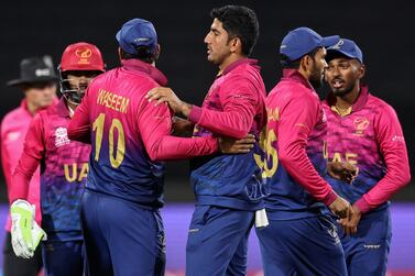 UAE players celebrate the wicket of Netherlands' Colin Ackermann during the Australia 2022 Twenty20 World Cup cricket tournament match between Netherlands and UAE at Kardinia Park, in Geelong, on October 16, 2022.  (Photo by Martin KEEP  /  AFP)  /  -- IMAGE RESTRICTED TO EDITORIAL USE - STRICTLY NO COMMERCIAL USE --