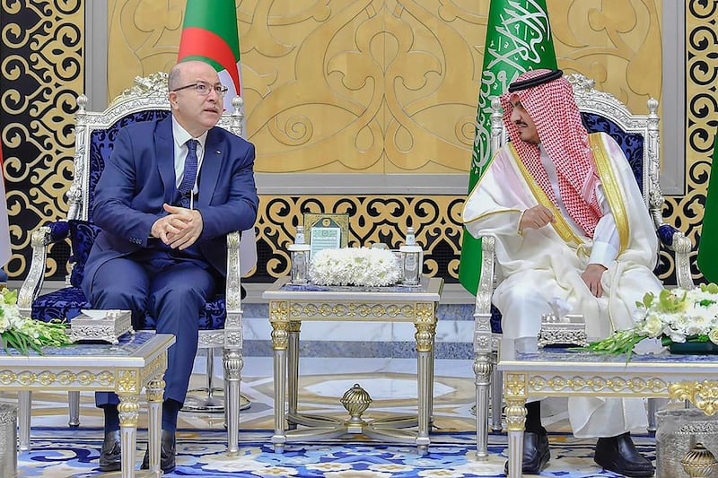 Prince Badr with Algeria's Prime Minister Aimene Benabderrahmane after the latter's arrival in Jeddah to take part in the Arab League summit. AFP