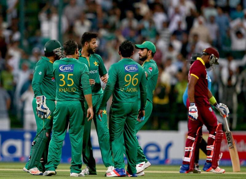 Imad Wasim of Pakistan celebrates with teammates after dismissing Dwaine Bravo of the West Indies during the third T20 International match between at Zayed Cricket Stadium on September 27, 2016 in Abu Dhabi. Francois Nel / Getty Images