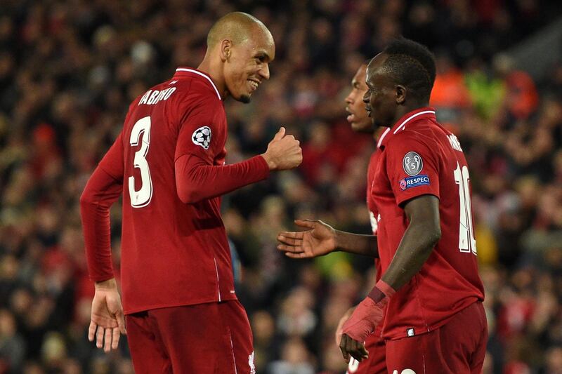 Liverpool's Senegalese striker Sadio Mane celebrates with Liverpool's Brazilian midfielder Fabinho. AFP