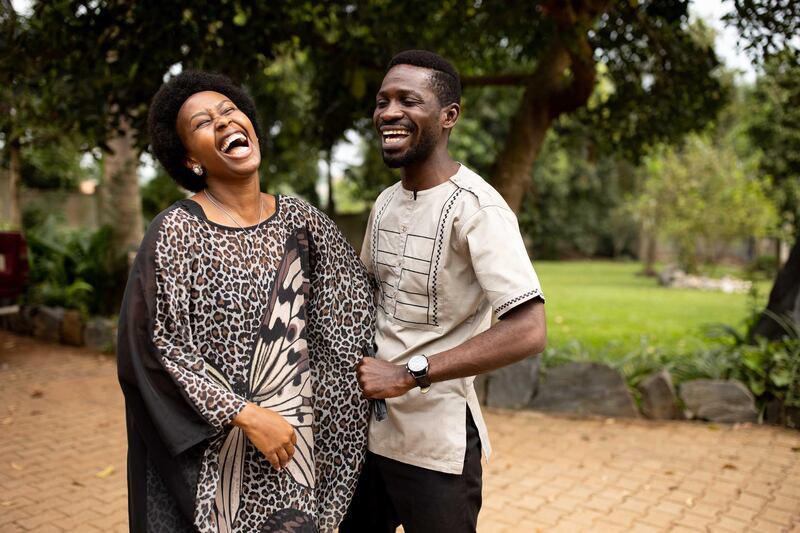 Opposition candidate, Bobi Wine and wife Barbara Itungo Kyagulanyi laugh during the Ugandan presidential elections in Kampala, Uganda. Getty Images