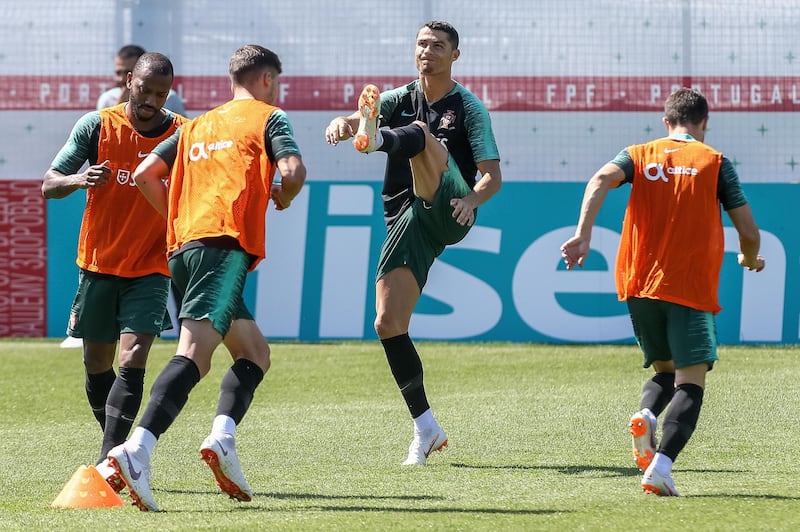 Cristiano Ronaldo (2-R) warms up during a training session at the Kratovo training camp in Ramensky, Moscow region, on Friday.  Paulo Novais / EPA