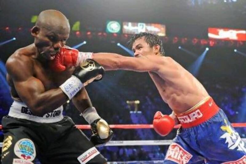 Manny Pacquiao, right, lands a straight left on the jaw of Timothy Bradley. According to CompuBox, the Filipino landed 34 per cent of his punches to the American's 19 per cent. Chris Carlson / AP Photo