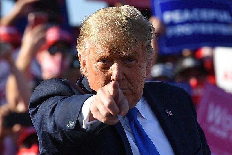 US President Donald Trump gestures as he speaks during a rally at Carson City Airport in Carson City. AFP