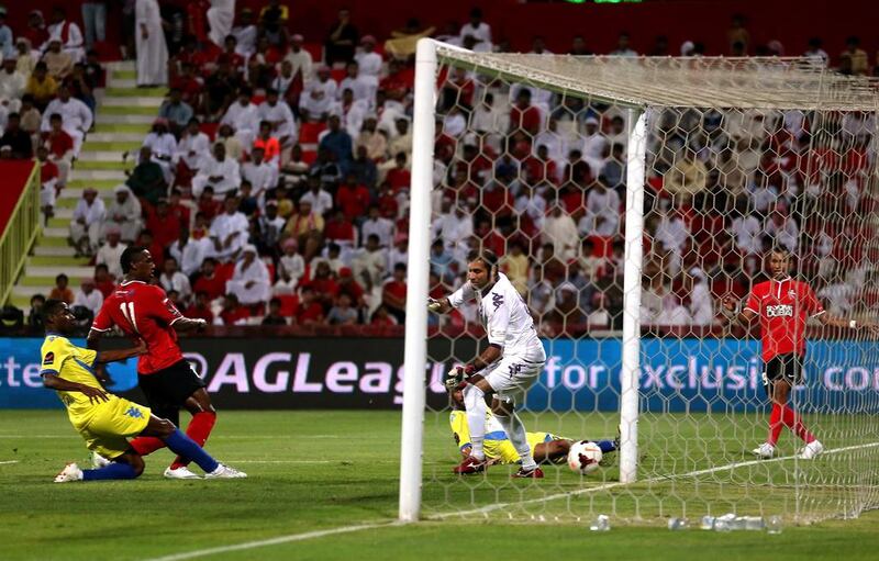 Ahmed Khalil of Al Ahli scores the second goal against Al Dhafra on Sunday. Warren Little / Getty Images   
