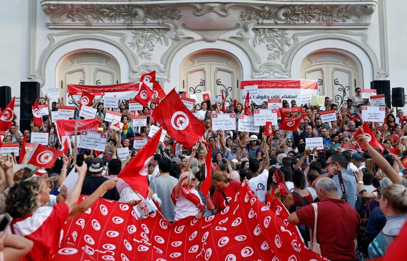 Protesters shout slogans and hold national flags during a rally, demanding equal inheritance rights for women, in Tunis, Tunisia August 13, 2018. REUTERS/Zoubeir Souissi