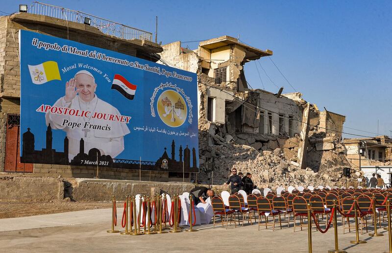 Organisers lay seats at the ruins of Al Tahera Church in the Old City of Mosul in northern Iraq. AFP