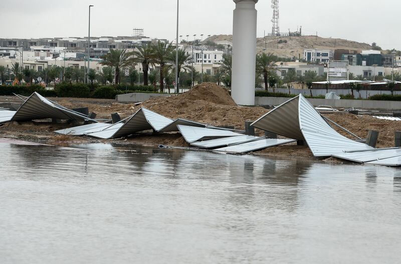 A fence surrounding a construction site toppled over because of heavy winds and rain in Dubai. Pawan Singh / The National 