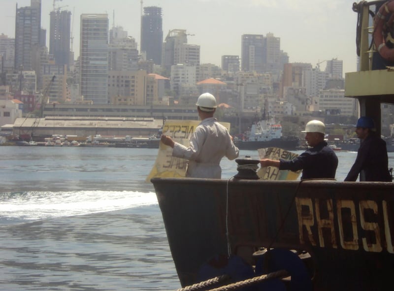 Crew of the Rhosus stage a protest aboard the arrested cargo vessel in the port of Beirut, Lebanon in 2014. Boris Musinchak / Reuters