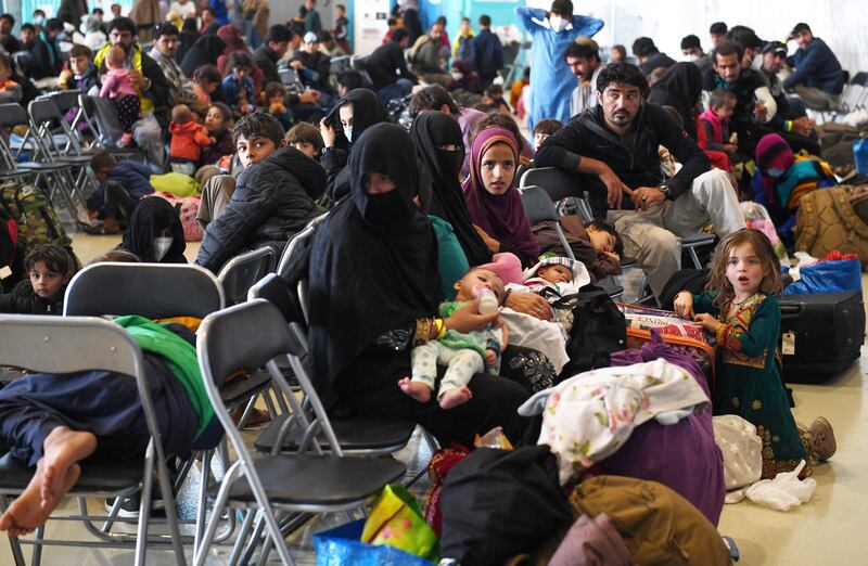 Afghan refugees wait to be processed inside Hangar 5 at Ramstein Air Base in Germany. Reuters