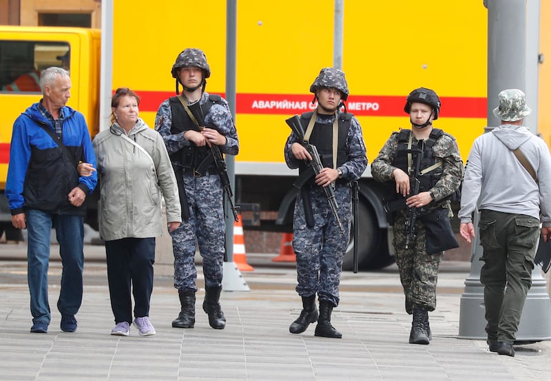 Russian servicemen stand on the streets of central Moscow. EPA