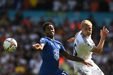 Chelsea's English midfielder Raheem Sterling (L) fights for the ball with Leeds United's Danish defender Rasmus Kristensen during the English Premier League football match between Leeds United and Chelsea at Elland Road in Leeds, northern England on August 21, 2022.  (Photo by Paul ELLIS / AFP) / RESTRICTED TO EDITORIAL USE.  No use with unauthorized audio, video, data, fixture lists, club/league logos or 'live' services.  Online in-match use limited to 120 images.  An additional 40 images may be used in extra time.  No video emulation.  Social media in-match use limited to 120 images.  An additional 40 images may be used in extra time.  No use in betting publications, games or single club/league/player publications.   /  