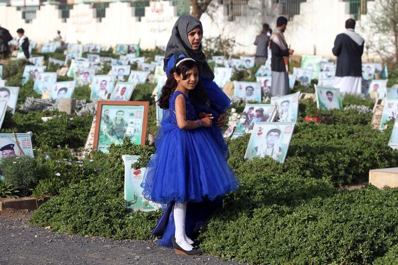 Children in the Yemeni capital Sanaa visit the graves of relatives on the first day of Eid Al Fitr.