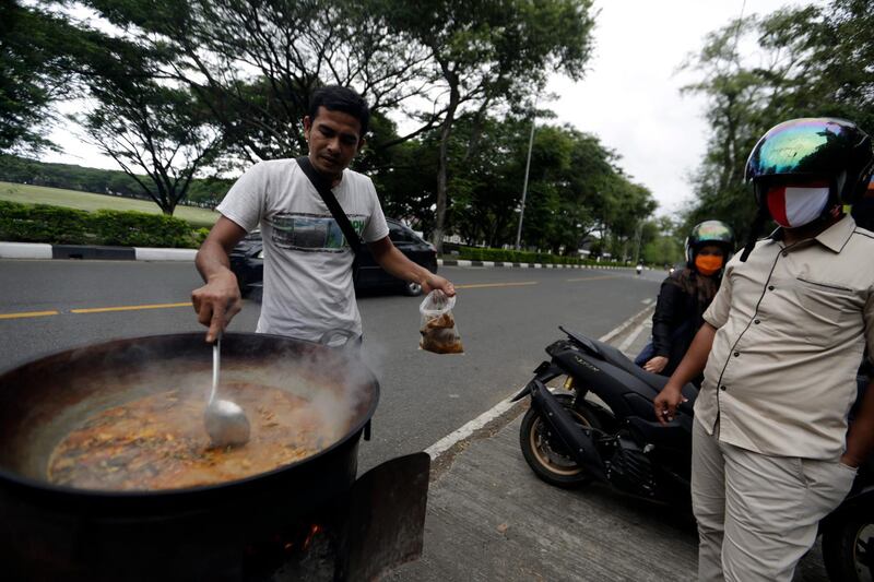 A street food vendor sells 'kari kambing', a goat curry. in Banda Aceh, Indonesia. EPA