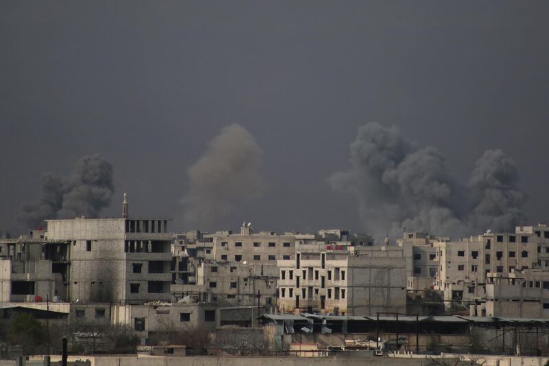 Smoke billows following Syrian government bombardment on the rebel-controlled town of Misraba, in the eastern Ghouta region on the outskirts of the capital Damascus on March 10, 2018. Ammar Suleiman / AFP