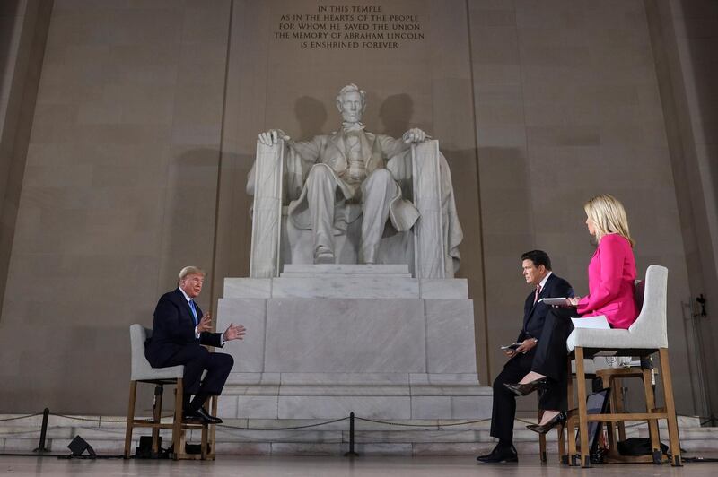 epa08399223 United States President Donald J. Trump (L) speaks during a virtual Town Hall at Lincoln Memorial in Washington, DC, USA, 03 May 2020.  EPA/Oliver Contreras / POOL