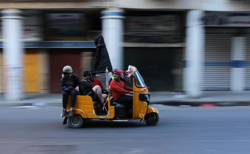 Demonstrators use a tuk-tuk during an ongoing anti-government protests. Reuters