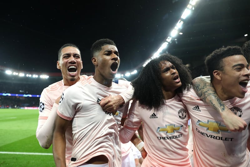 PARIS, FRANCE - MARCH 06: Marcus Rashford of Manchester United celebrates after scoring his sides third goal with teammates Chris Smalling and Tahith Chong during the UEFA Champions League Round of 16 Second Leg match between Paris Saint-Germain and Manchester United at Parc des Princes on March 06, 2019 in Paris, . (Photo by Julian Finney/Getty Images)