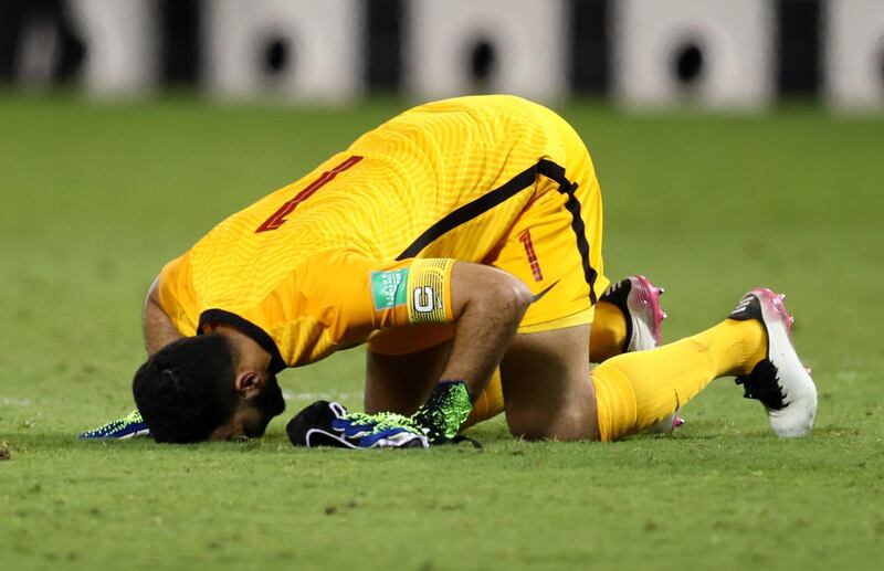 Qatar's Saad Al Sheeb celebrates after the match.