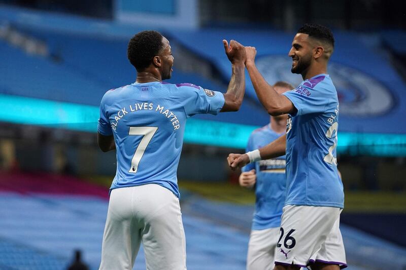 Manchester City's English midfielder Raheem Sterling celebrates scoring the opening goal. AFP