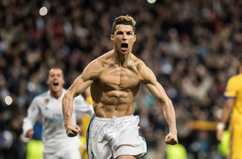 epa06662456 Real Madrid's Cristiano Ronaldo (R) celebrates after scoring the 1-3 during the UEFA Champions League quarter final, second leg soccer match between Real Madrid and Juventus at Santiago Bernabeu stadium in Madrid, Spain, 11 April 2018.  EPA/RODRIGO JIMENEZ