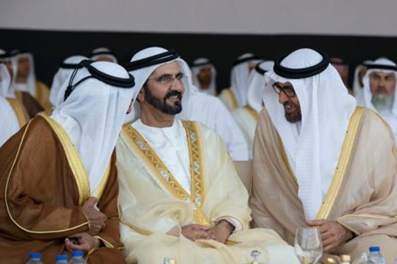 ABU DHABI, UNITED ARAB EMIRATES - March 20, 2013: HH Sheikh Tahnoon bin Mohammed Al Nahyan Ruler's Representative of the Eastern Region (L), HH Sheikh Mohammed bin Rashid Al Maktoum Vice-President Prime Minister of the UAE and Ruler of Dubai (C), and HH General Sheikh Mohamed bin Zayed Al Nahyan Crown Prince of Abu Dhabi Deputy Supreme Commander of the UAE Armed Forces (R), attend an Al Nahyan wedding. ..The wedding reception is held in honour of HH Sheikh Diab bin Mohamed bin Zayed Al Nahyan (NOT SHOWN) who is marrying the daughter of HH Sheikh Hamdan bin Zayed Al Nahyan Deputy Prime Minister and Ruler of the Western Region (NOT SHOWN) and HH Sheikh Zayed bin Saeed bin Zayed Al Nahyan (NOT SHOWN), who is marrying the daughter of HH Sheikh Hazza bin Zayed Al Nahyan National Security Advisor for the United Arab Emirates and Vice Chairman of the Abu Dhabi Executive Council (NOT SHOWN). The event also celebrated the marriage of one hundred additional grooms. .( Ryan Carter / Crown Prince Court - Abu Dhabi ).---