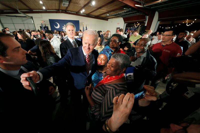 Democratic presidential candidate, former Vice President Joe Biden, takes photos with supporters after speaking at a campaign event in Columbia, S.C. AP Photo
