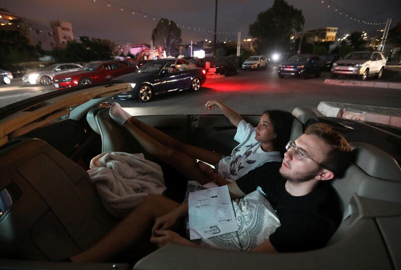 People watch a film from their cars at a drive-in cinema in Byblos, Lebanon. Reuters